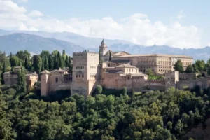 Alhambra Gardens (Spain) with building and green trees